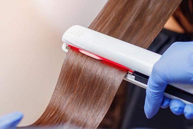 flat ironing stage of a keratin hair treatment 