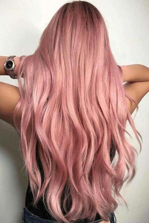A woman with long rose gold hair