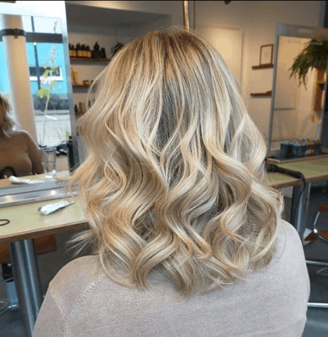 Woman with balayage hair in a saloon