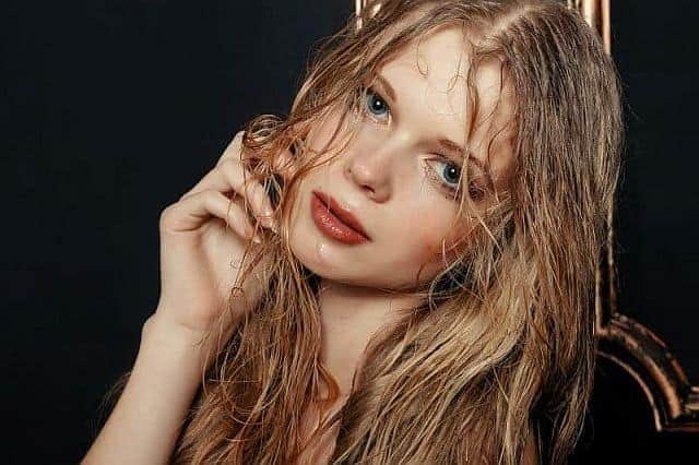 A girl with wet hair after removing color