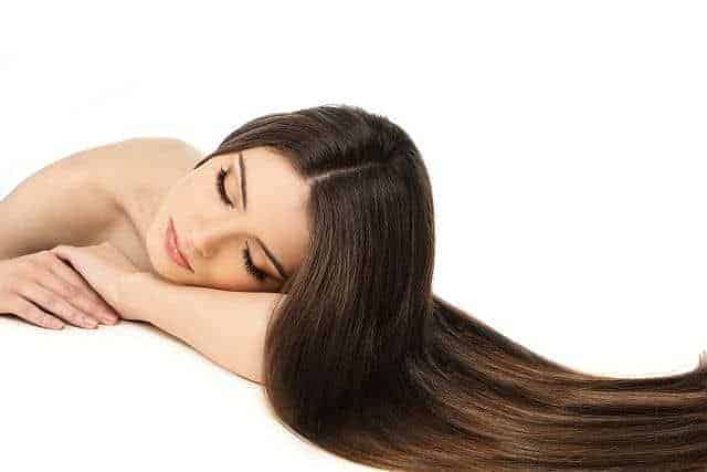 A woman with amino acid hair smoothing treatment lying on the table