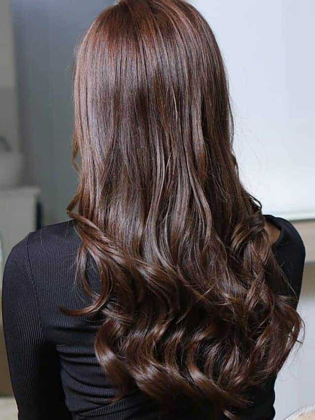 A woman with wavy hair after cellophane hair treatment
