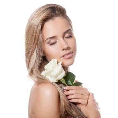 Beautiful Blond Girl holding White Rose
