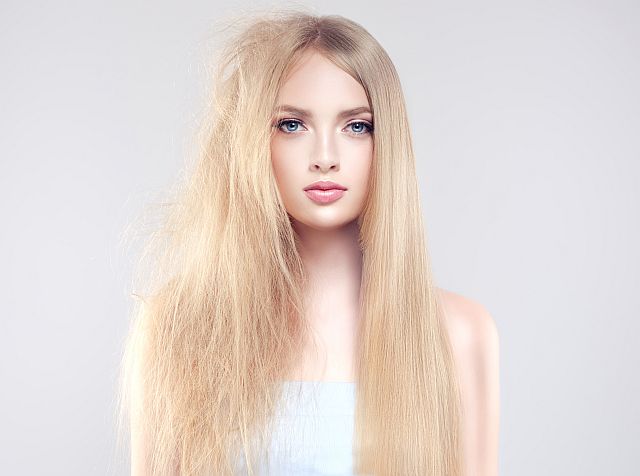 Blonde woman with partially smooth and partially unbrushed hair
