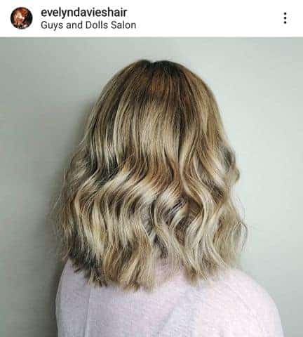 Woman with highlights in Gays and Dolls Salon