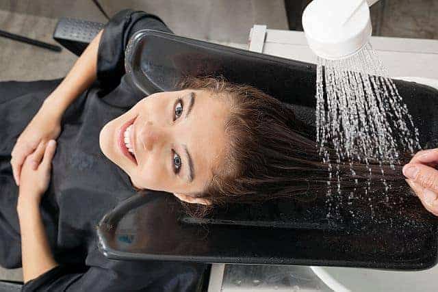 a client getting a hair wash at a beauty salon