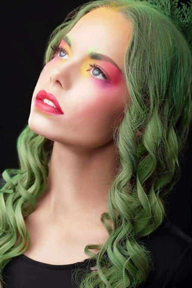 a girl with green temporary hair color