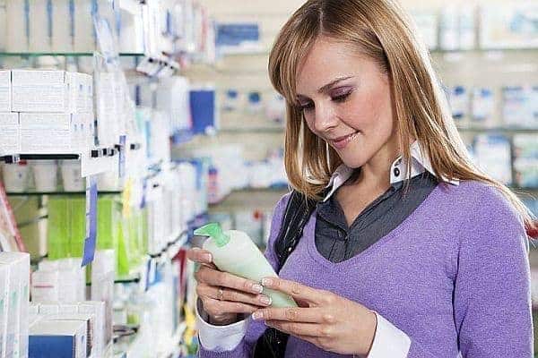 a woman shopping for a lightening shampoo