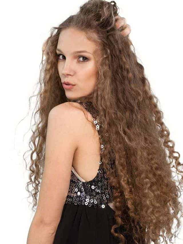 a young girl with curly untangled hair