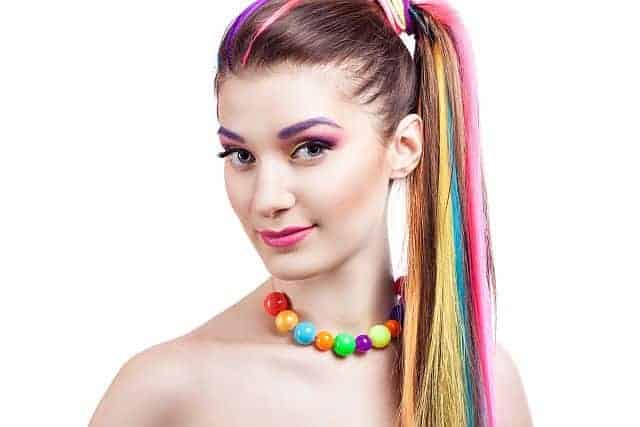 a girl with colorful clip in hair extensions