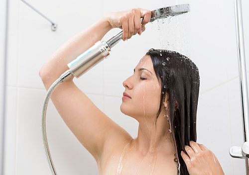 washing hair with the extensions under a shower