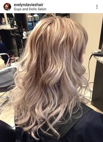 pretty woman with highlighted hair in the salon
