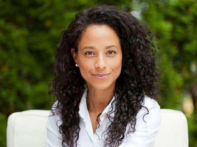 a mixed-race woman with healthy co-washed hair