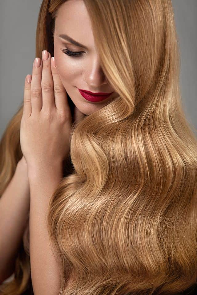 Beautiful blonde woman with invisible type-in extensions in her hair