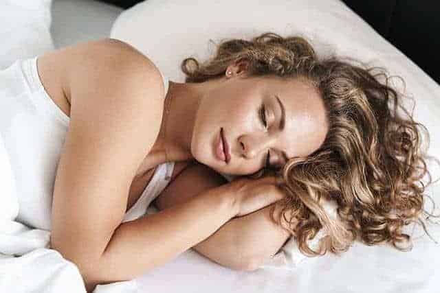 a beautiful sleeping woman with oily hair