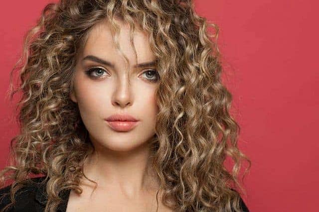 a model with permed fine hair