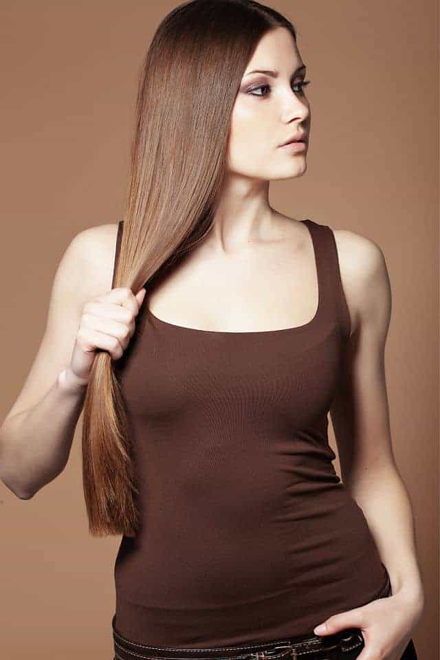 attractive woman with hair washed with a straightening shampoo