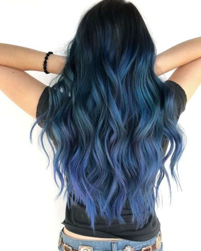 A girl with faded semi-permanent blue color