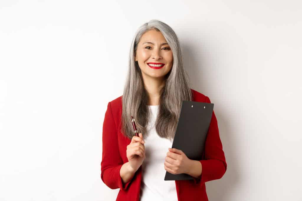 Assian business woman with gray hair