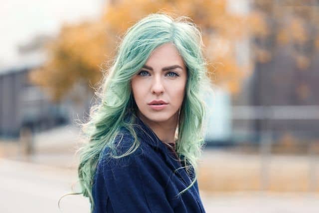 young woman with green hair