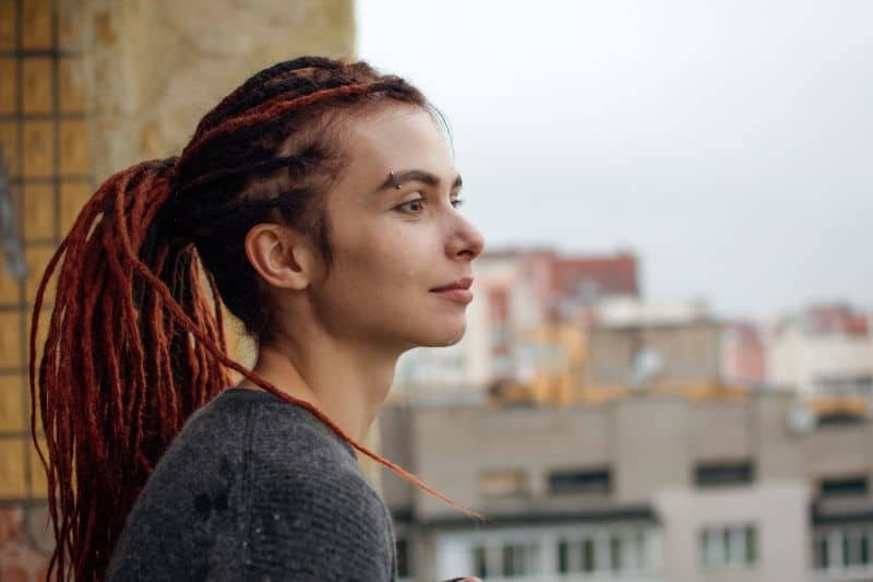 Attractive girl with red dreadlocks 