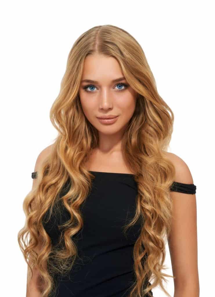 Young smiling woman wearing hair extensions