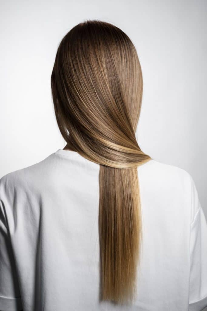 a woman with highlighted and keratin-treated hair