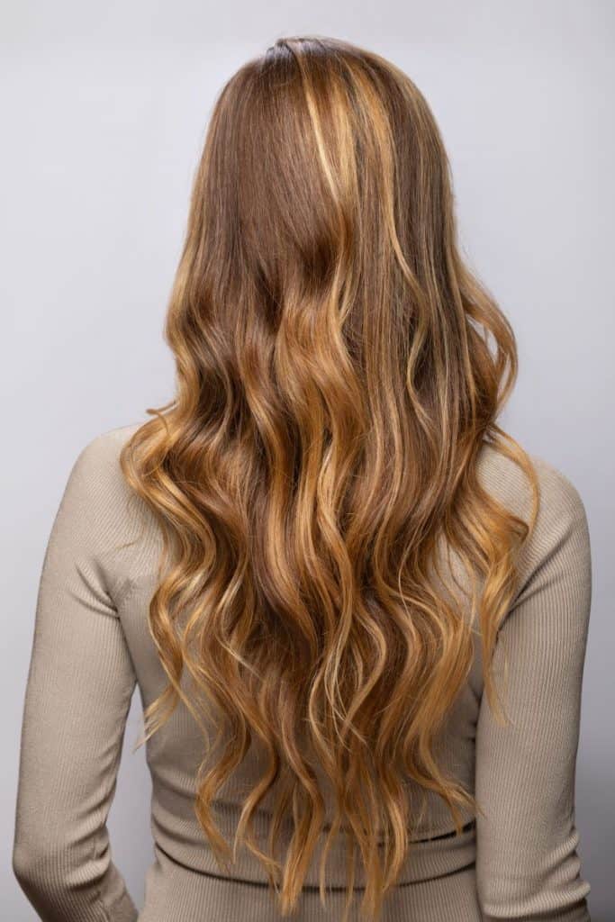 back view of woman with partial balayage hair
