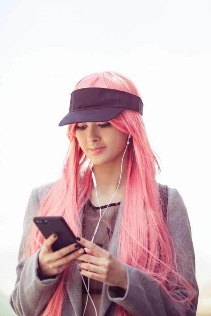 fashion Asian girl with synthetic wig hair outdoors