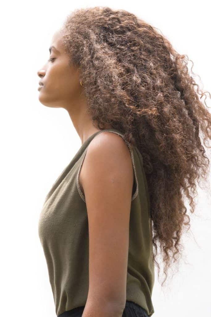 Dark skinned girl with long curly hair