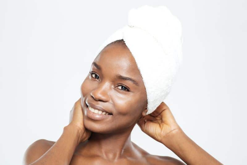dark-skinned woman with a towel around her head