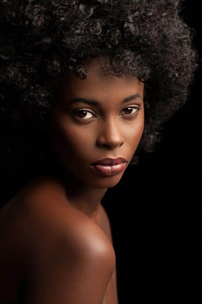 Dark skinned woman with coiled hair