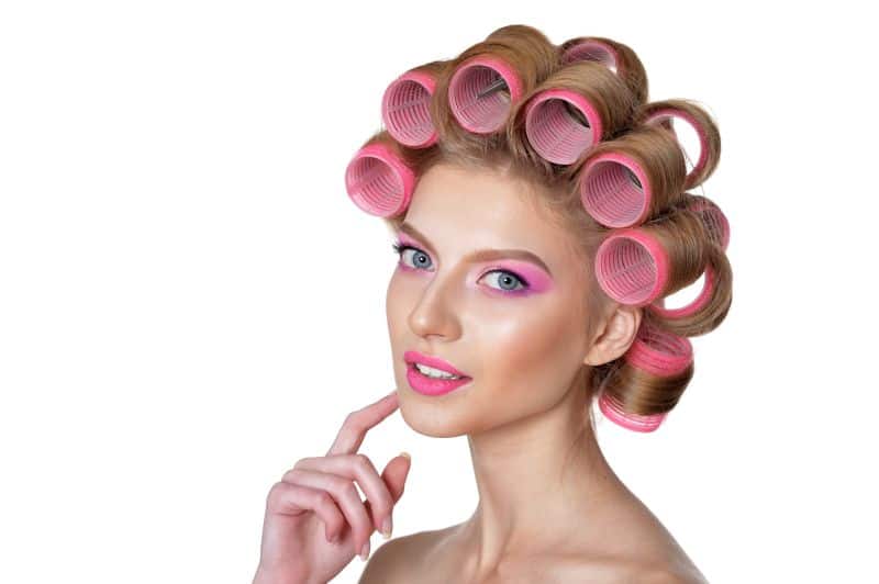 beautiful woman with velcro hair curlers
