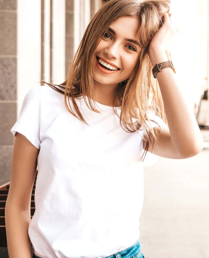 smiling blond girl wearing white shirt