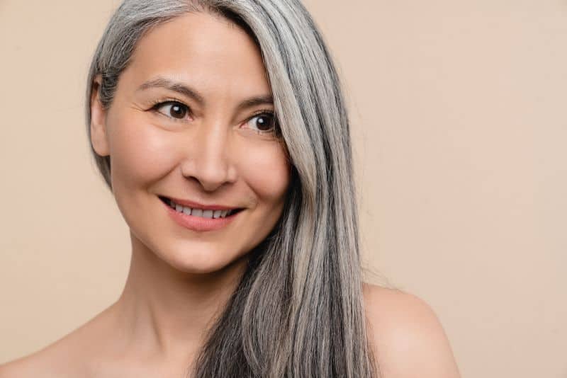 beautiful middleaged woman with long grey hair hair 