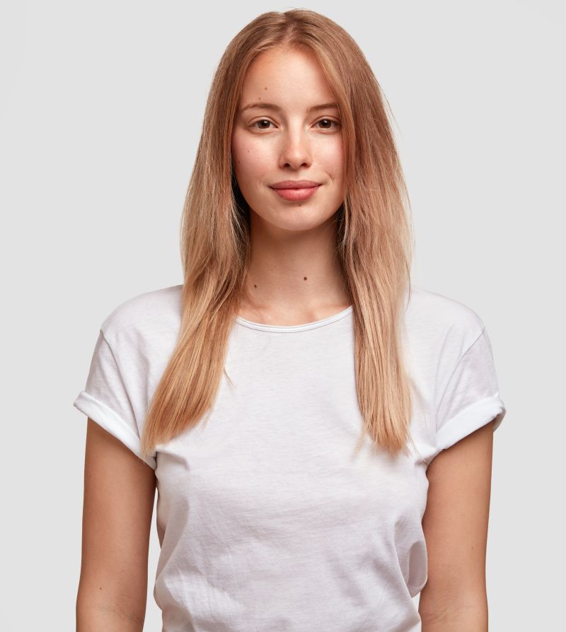 charming blonde woman in wite shirt with clean hair