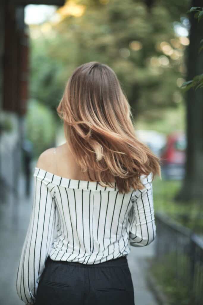 walking woman with ombre hair